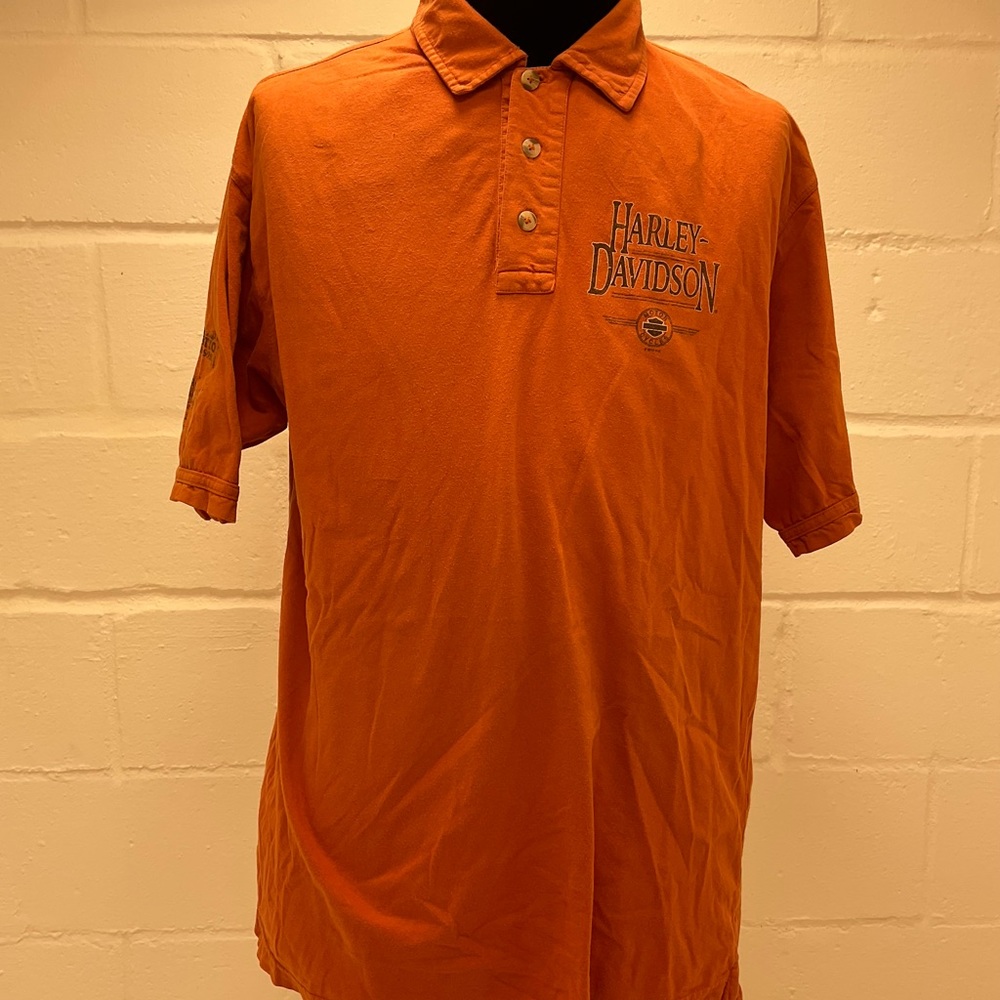 Orange colored Harley Davidson shirt. With white tag.